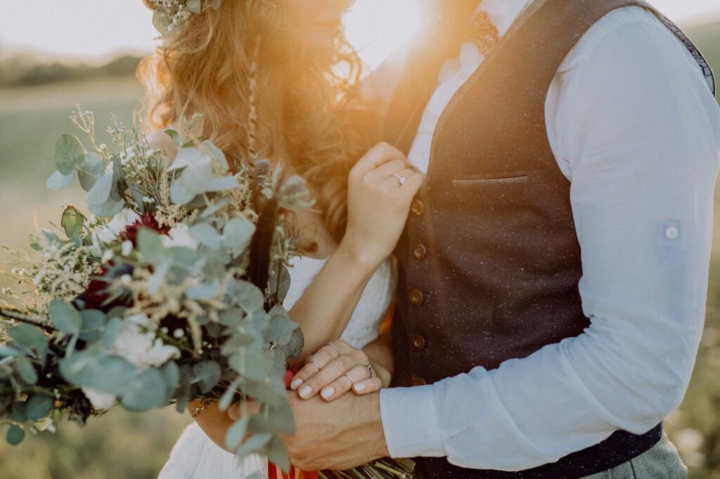 beautiful-bride-and-groom-at-sunset-in-green-natur-PSP7T5E.jpg